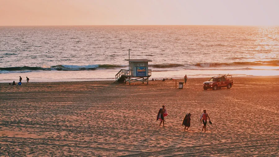 A lifeguard tower on a South Bay beach at sunset